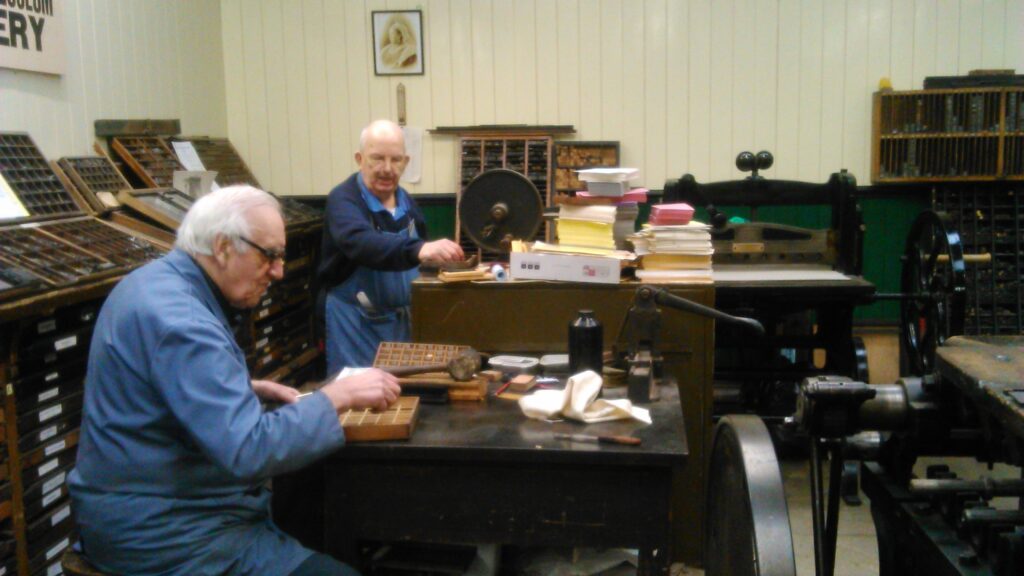 Donald and Jimmy sorting type in the gallery.