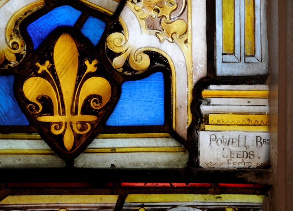 close up of window showing 'Powell Bros Leeds'