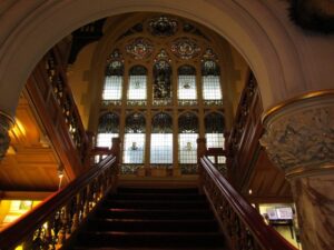 Stained glass window from the bottom of a grand staircase