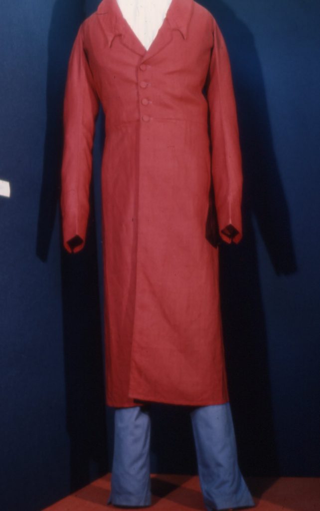 Outfit worn by Richard Fawcett during the Bishop Blaise Parade in 1825. Red long over jacker and blue trousers