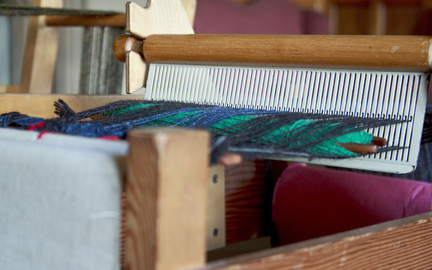 Pupils get ‘hands on’ with the basic processes by which the fleece of a sheep is turned into cloth at Bradford Industrial Museum