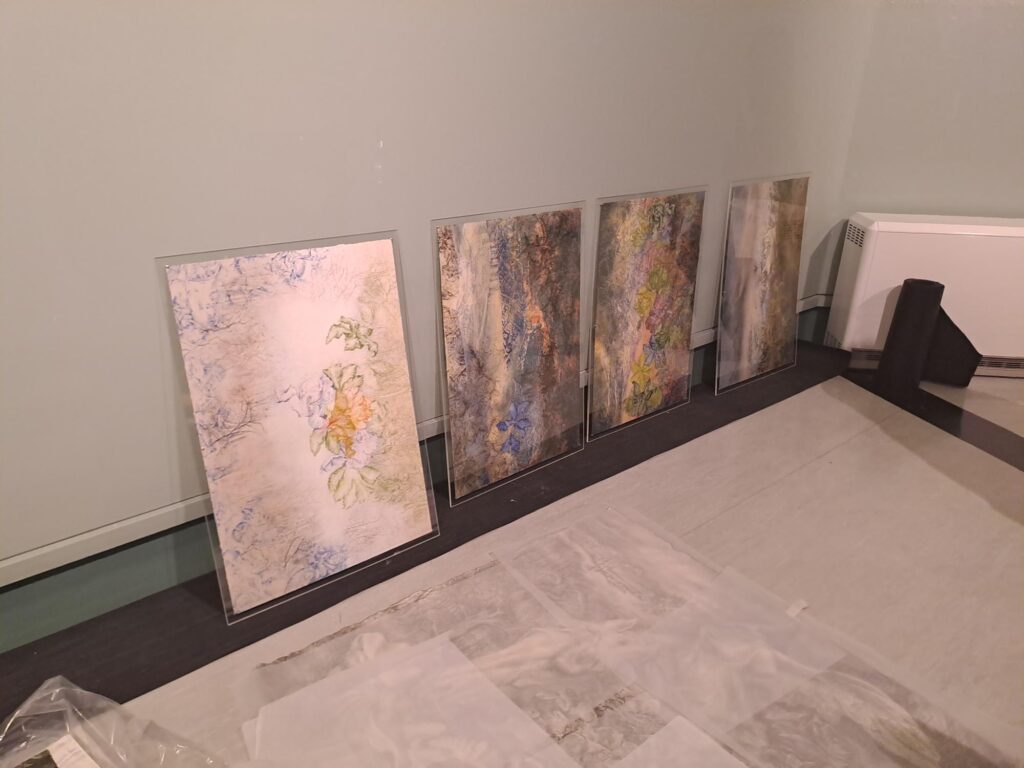 Image of artwork leaning against a wall