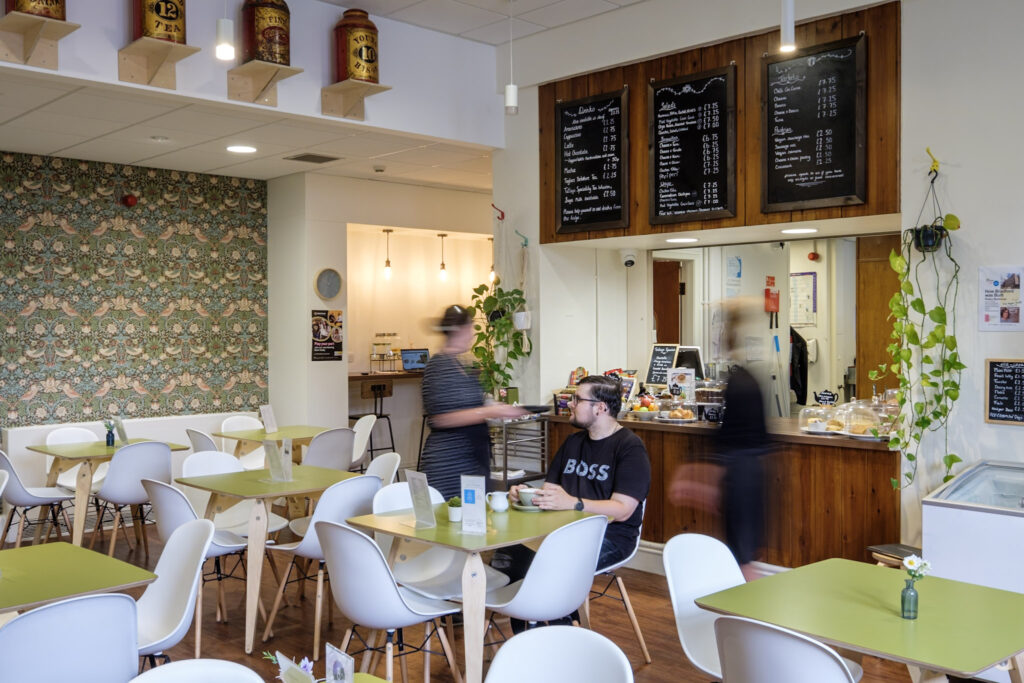 people sat in the cafe with food