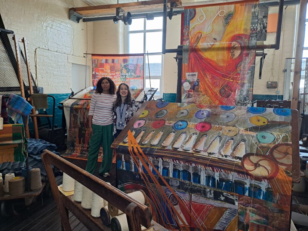 Lauren and Rhian in the Gallery with the textile pieces