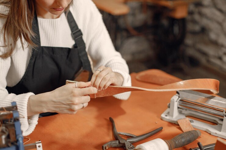 Leather working - hands and apron visible but not face