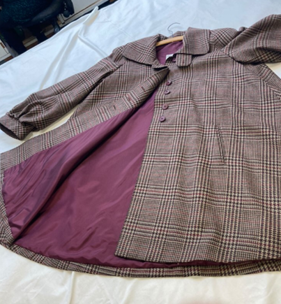 Image of a tweed coat - brown and purple weave pattern, with a purple lining