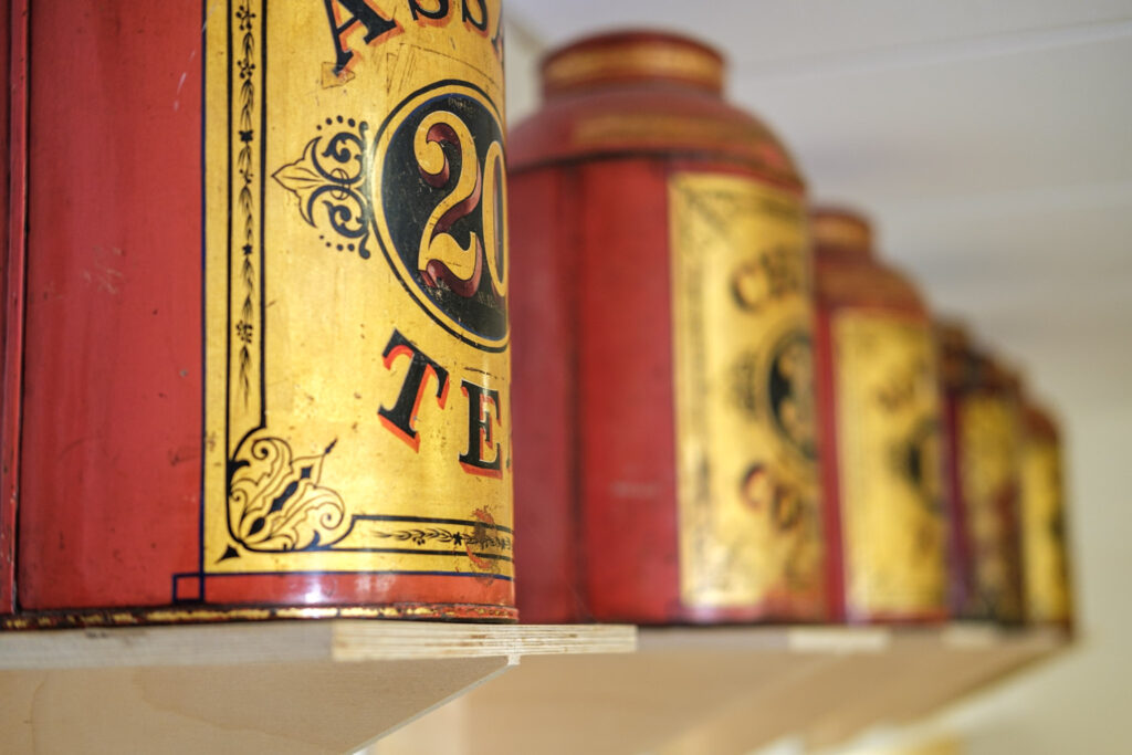 metal tea caddys in red and gold