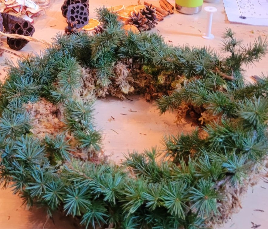 close up of a christmas wreath made from natural materials