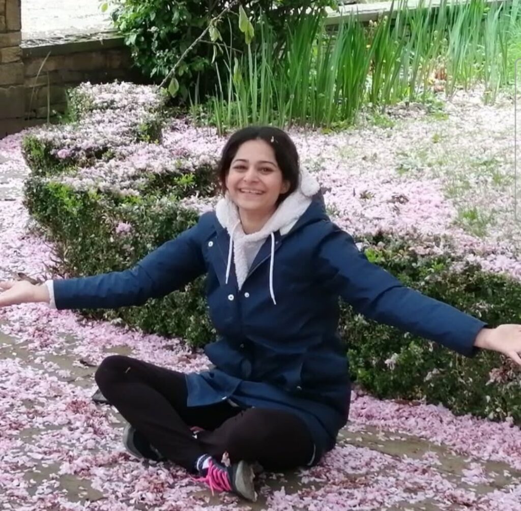 Fatima sat in the gardens surrounded by Cherry Blossoms