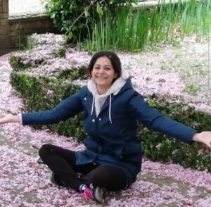 Fatima sat in the gardens surrounded by Cherry Blossoms