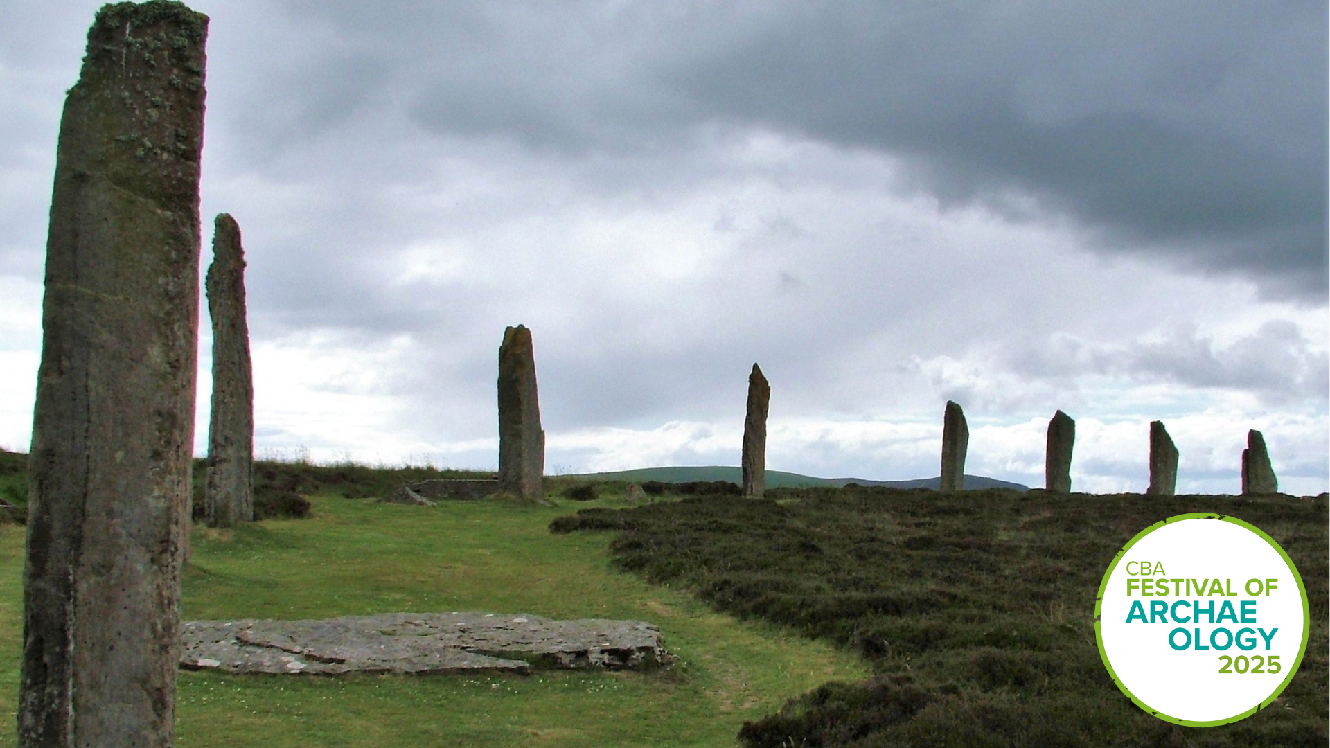 a atmospheric image of a stone circle with a stormy sky in the background