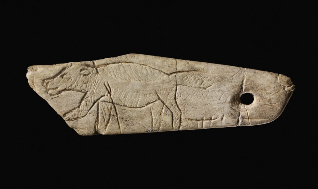 Engraved bone pendant depicting a wolverine ©The Trustees of the British Museum