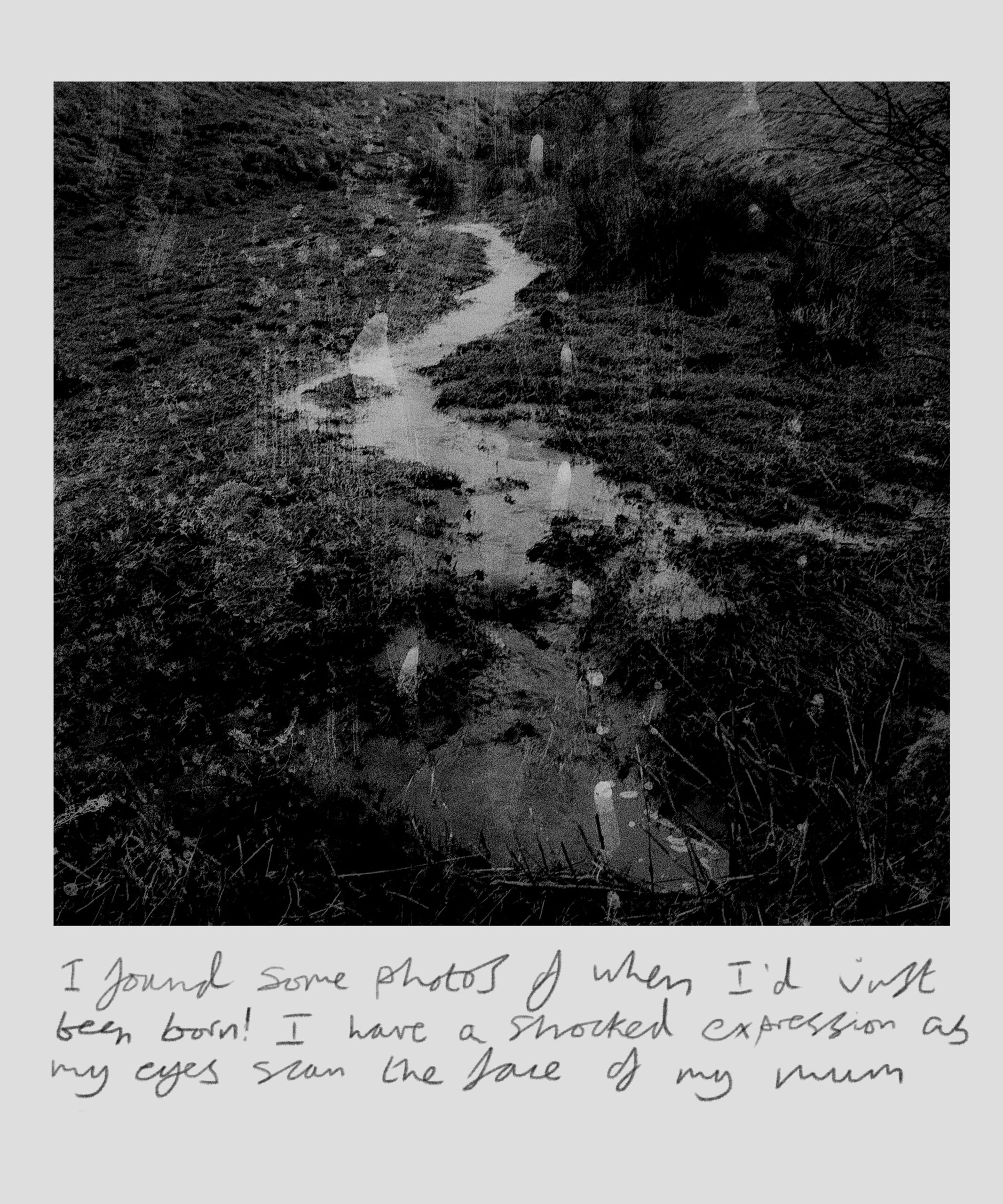 B&W image of a stream surrounded by mud