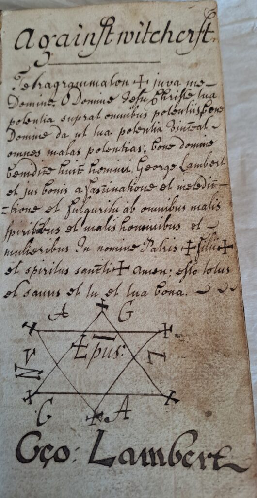 Handwritten prayer and protective charm against witchcraft, featuring Latin invocations and a symbolic diagram.