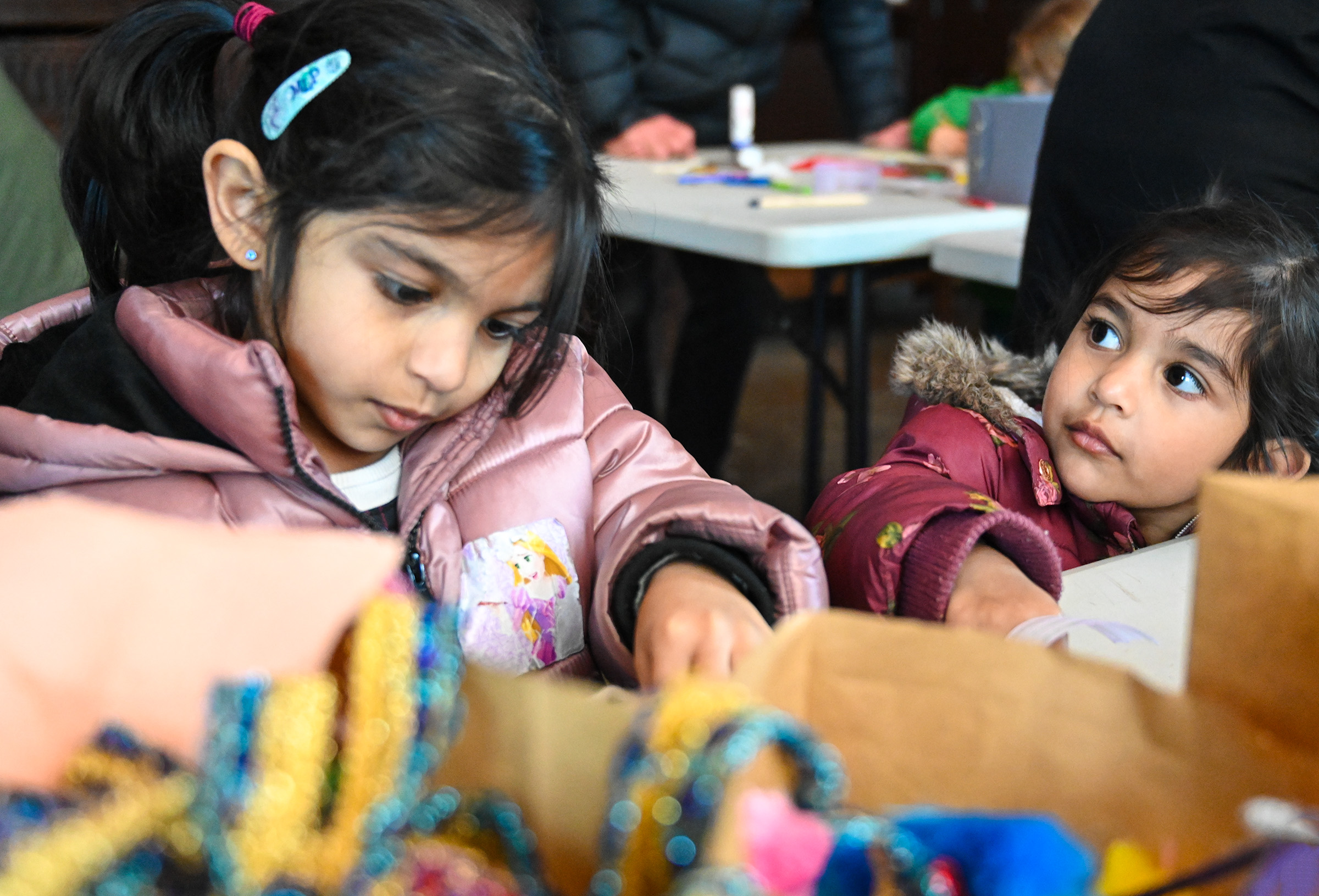 two young children taking part in a craft activity