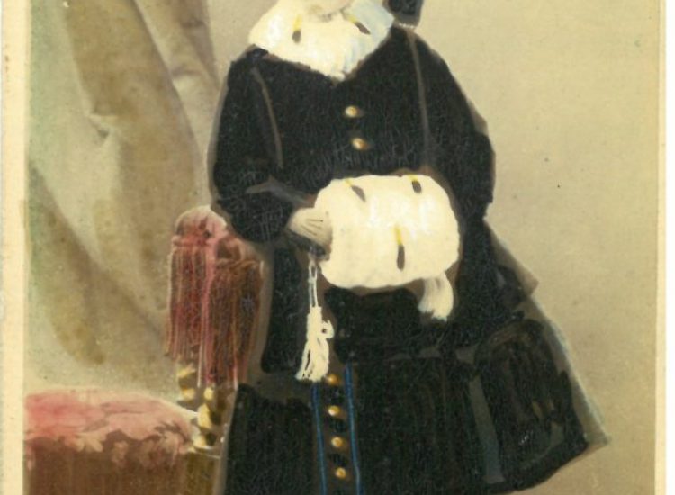Tinted photograph of Kitty as a young child. (on the reverse is a dedication from Kitty to her Uncle Henry)
