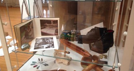 View inside exhibition with close up of old boots